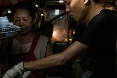 Young man working in Linjiang Night Market