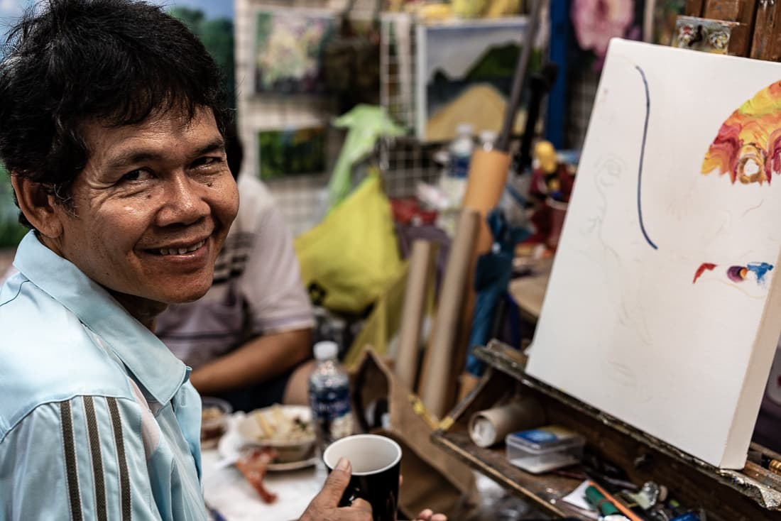 Smile of a painter in Chatuchak Market