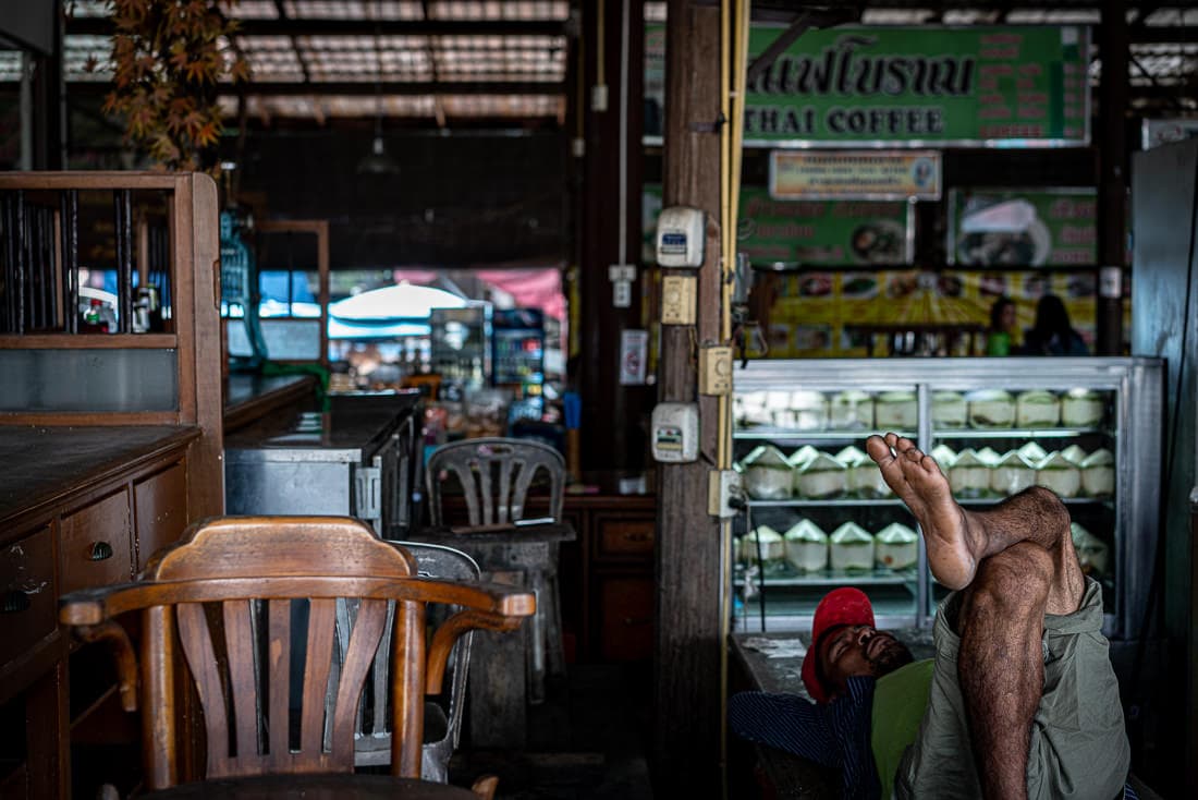 Man sleeping in a deserted shop