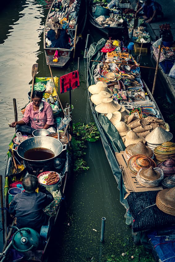 Big pot and many hats on boats