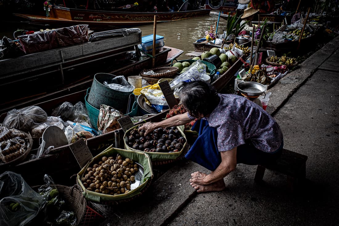 Woman reaching her hand for mangosteen