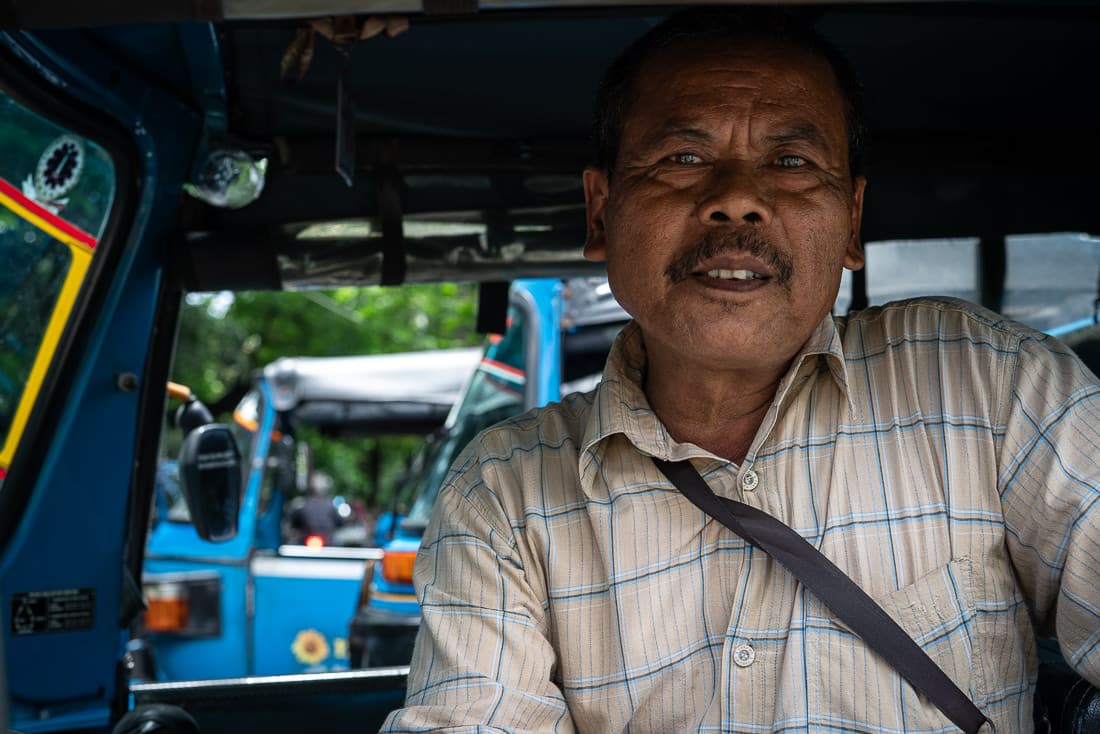Bajaj driver with a suspicious face