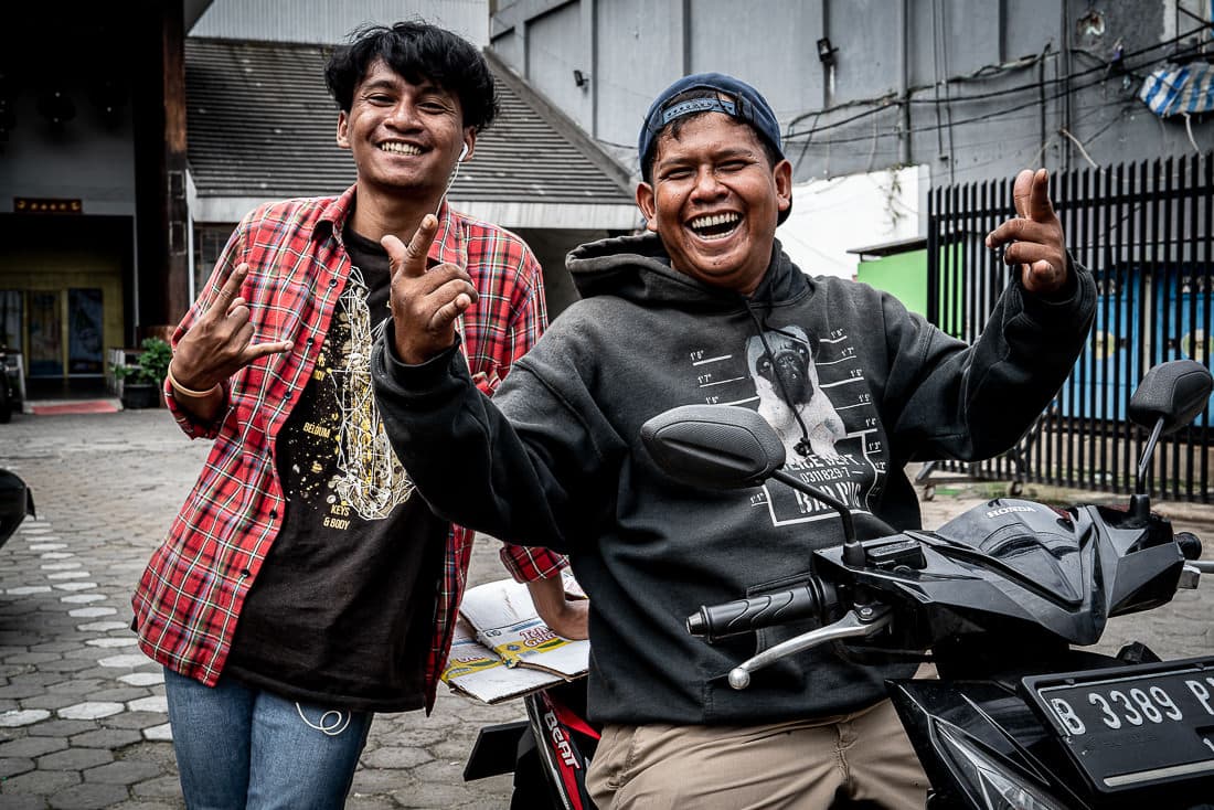 Two men striking a pose cheerfully