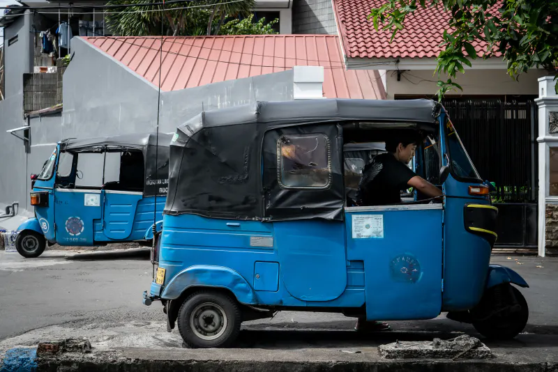 Bajaj waiting for customers on the bridge