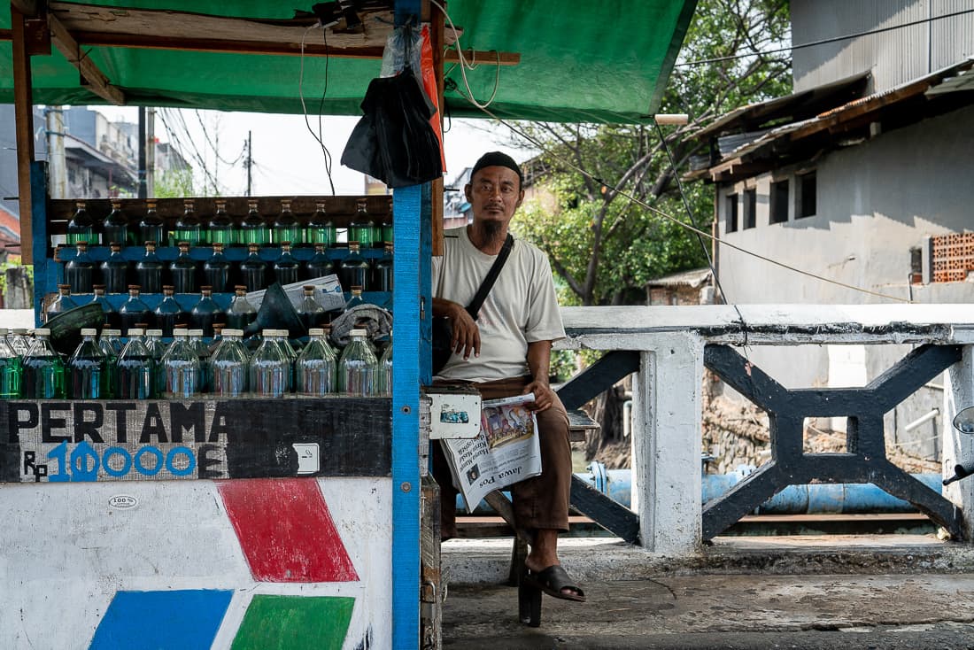 Man selling light diesel oil on the bridge