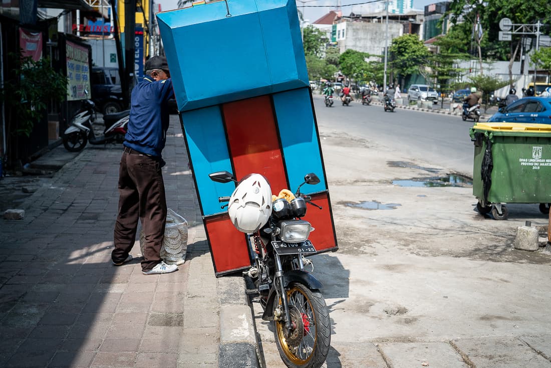 Motorcycle with a large box attached to the rear