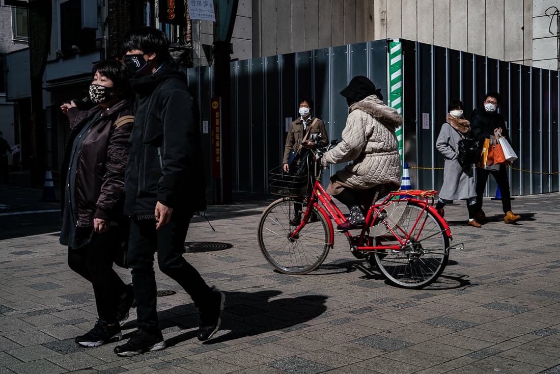 Pedestrians and a bicycle