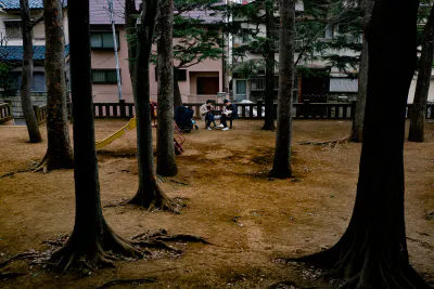 A family picnicking in the park at Taishido Hachiman Jinja Shrine