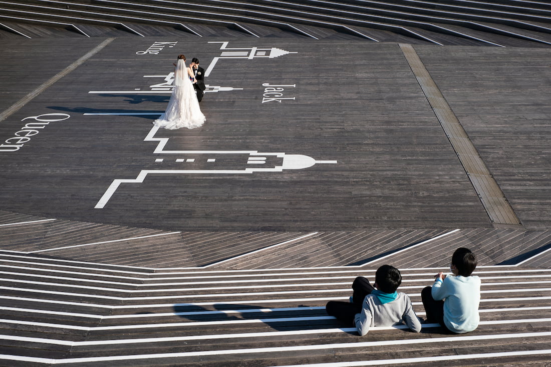 Couple taking wedding photos at Osanbashi Pier