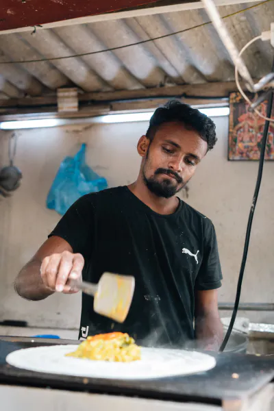 Man baking dosa