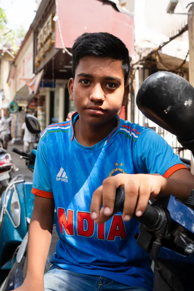 Young man in India's national cricket uniform