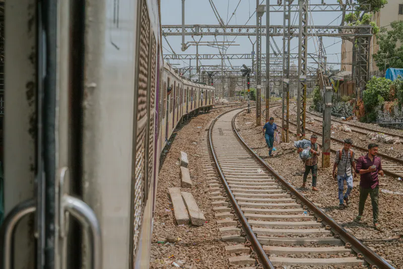 Men walking by the railroad tracks