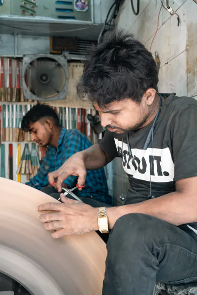 Man sharpening scissors