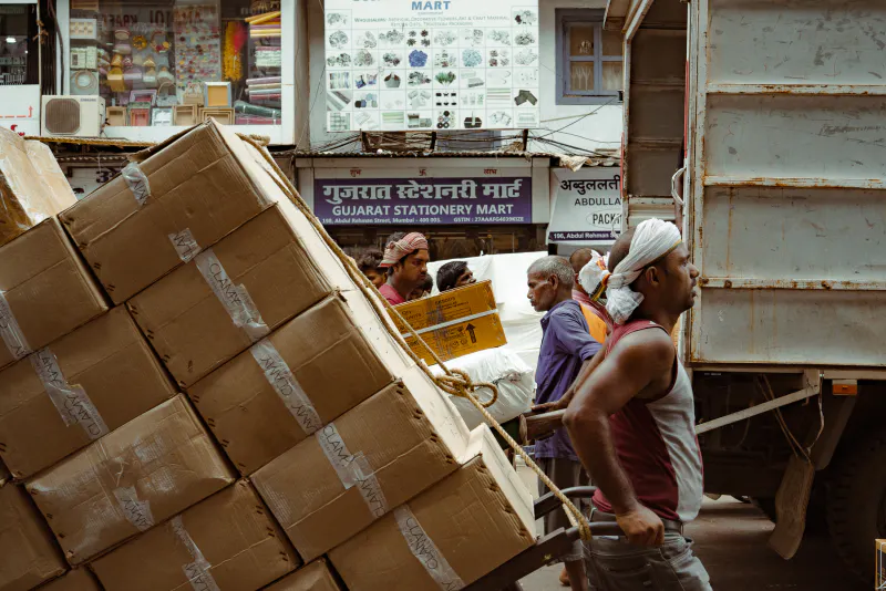 Man carrying cargo in wholesale district