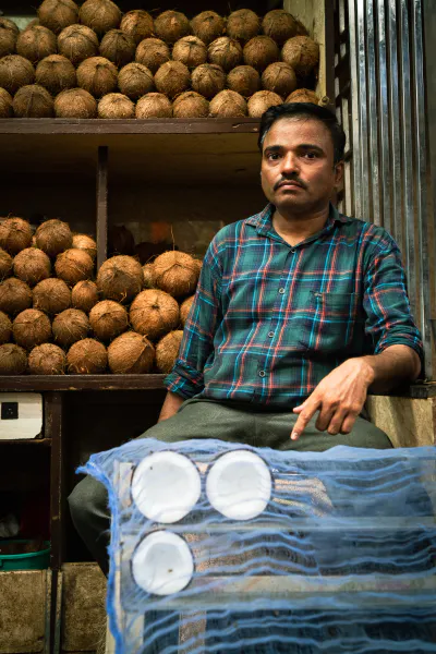 Man selling coconuts