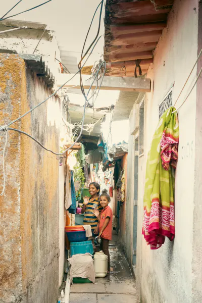 Girls standing in an alley