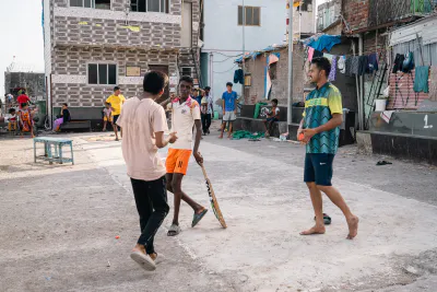 Men playing cricket