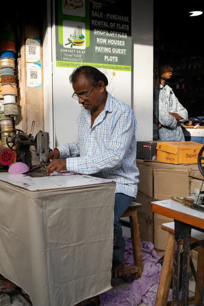 Man controling the sewing machine