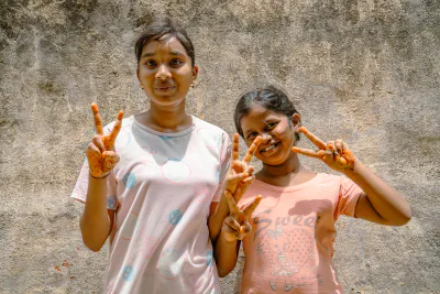 Girls making peace sign