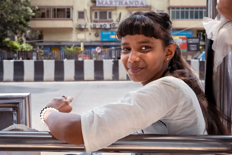 Girl at a bus stop
