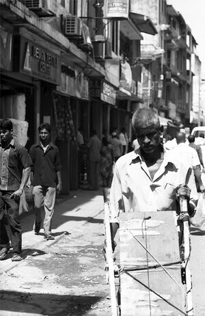 Man pushing empty cart