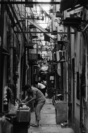 Local people doing housework in lane
