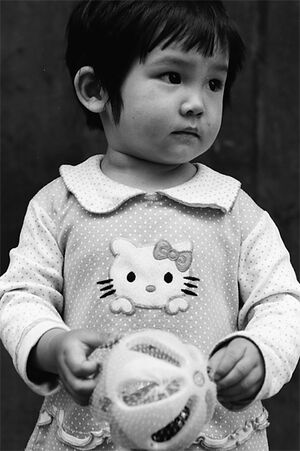 Little girl wearing clothes with Kitty