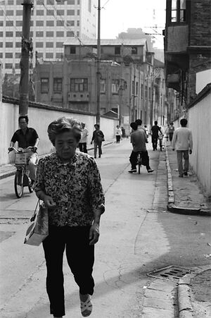 Downcast woman walking street