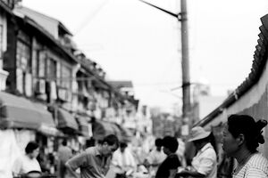 Woman standing still in street market