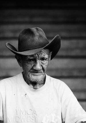 Wrinkle-faced old man with cowboy hat