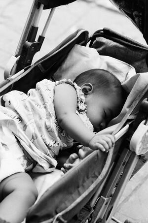 Baby sleeping well in baby buggy