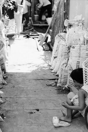 Girl sitting alone in lane