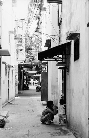 Mother and her baby in alleyway