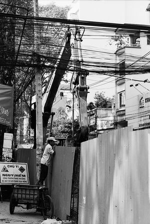 Man peeking into other side of fence