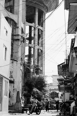Big water tower towering at end of street