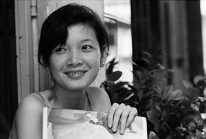 Woman smiling bashfully