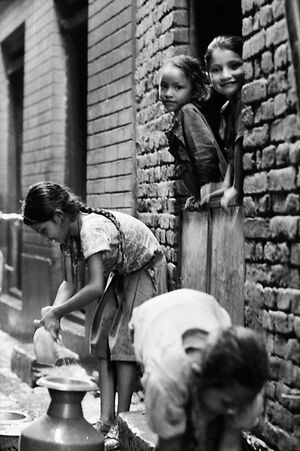 Girl collecting rain water