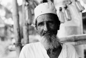 Man wearing white beard and white cap