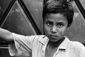 Boy watching with displeased eye