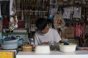 young man making betel nuts