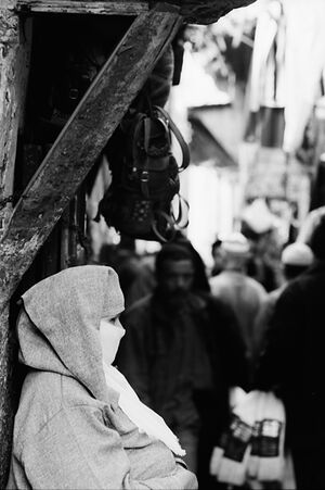 Woman standing in street corner