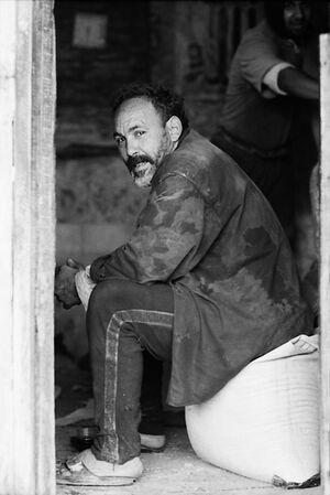 Man sitting on bag