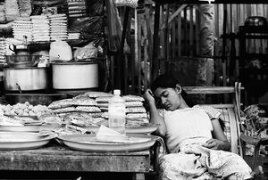 Woman sleeping in storefront