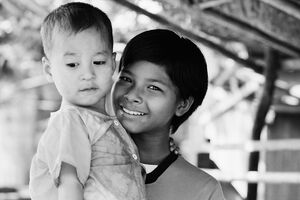 Young woman holding baby