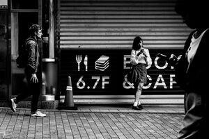 Girl standing in front of shutter