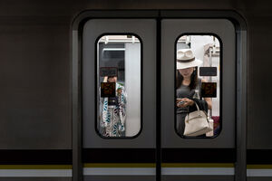 Woman in train car