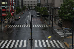 Yellow umbrella on pedestrian crossing