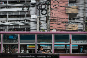 Shade-wearing woman on bus