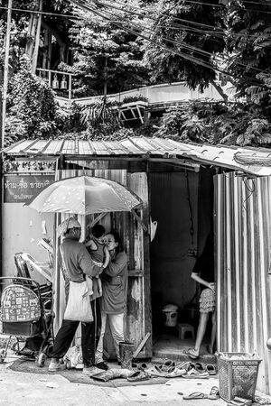 Baby held under umbrella