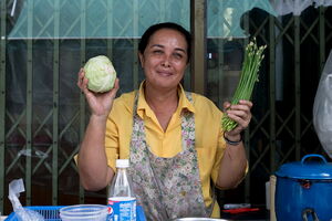 Woman having cabbage and chive